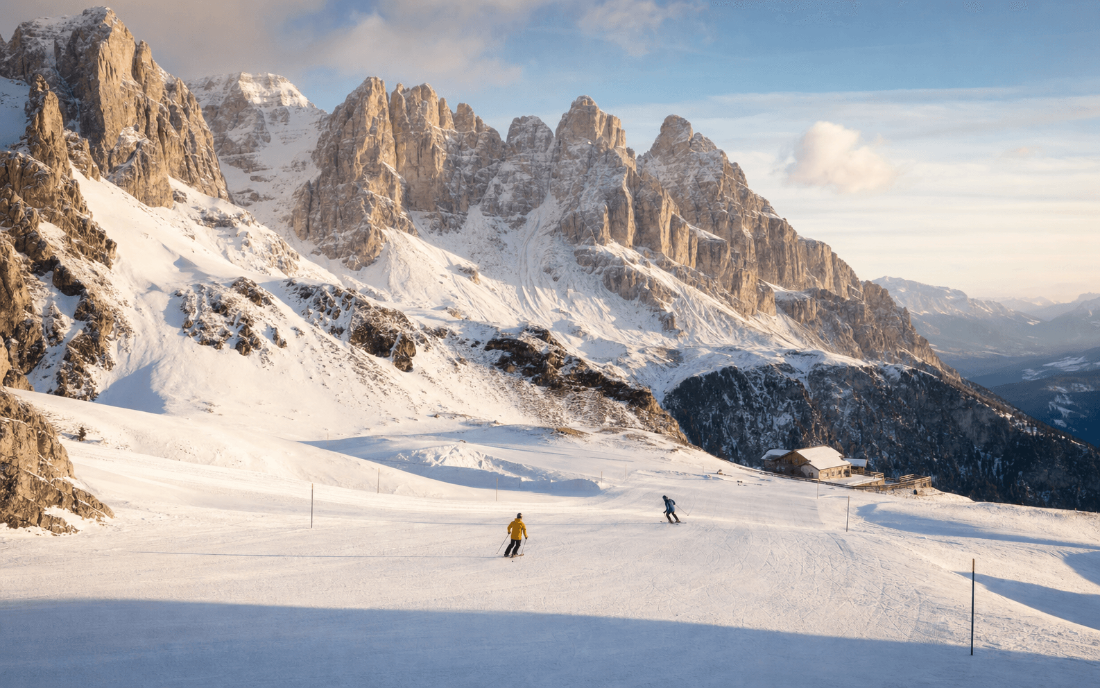 Sunlit ski pistes winding beneath the limestone towers of the Dolomites